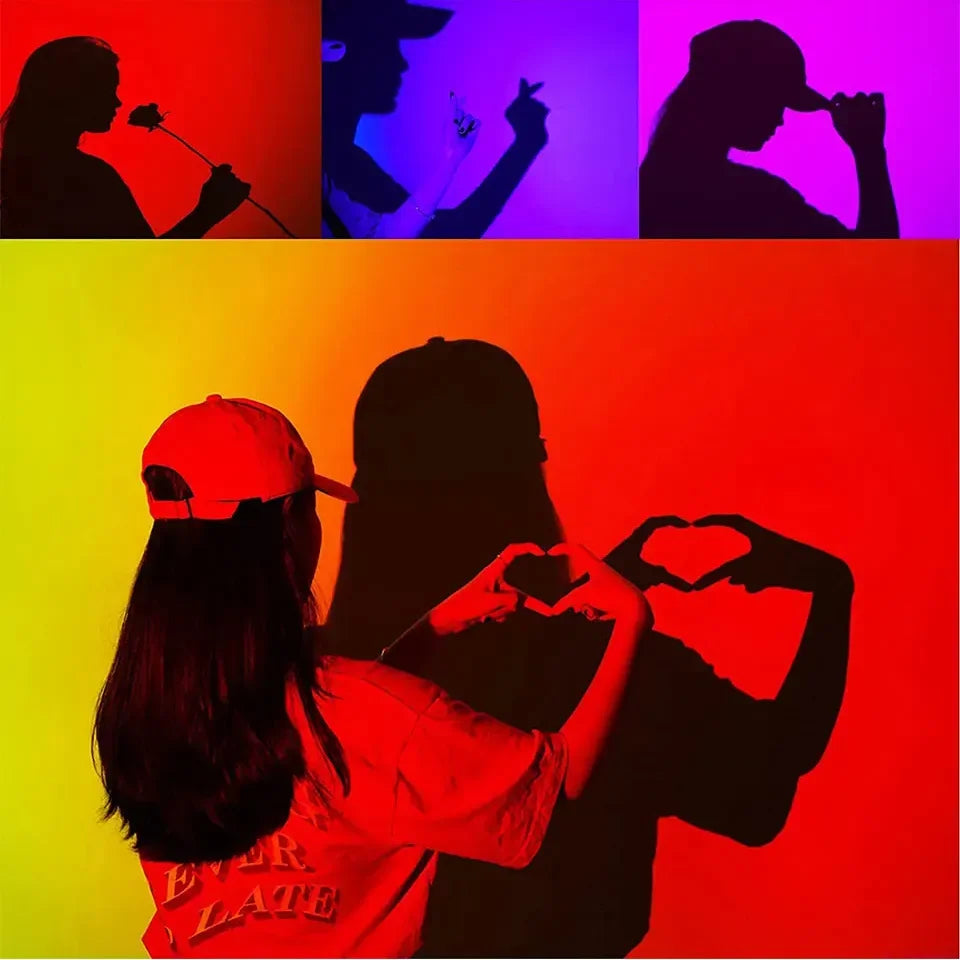 Couple making heart shapes with hands, colorful silhouette art, romantic shadow photography