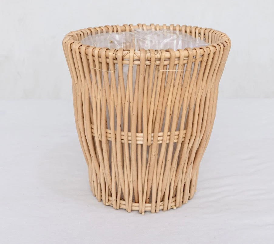 Natural wicker trash can with clear liner, rustic woven design for home or office use