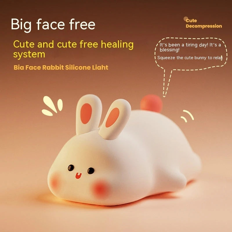 Cute white silicone bunny night light with rosy cheeks, soft glow, and squishy design for stress relief