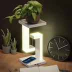 Modern LED desk lamp with wireless charging, plant stand, and USB ports for cozy home office setup