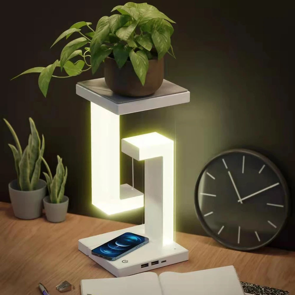Modern LED desk lamp with wireless charging, plant stand, and USB ports for cozy home office setup