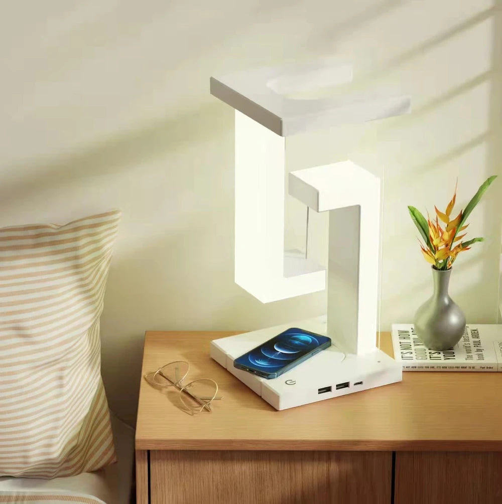 Modern white LED bedside lamp with wireless phone charger and USB ports on wooden nightstand