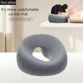 Gray face pillow with hole for comfort during massage, no face marks, ideal for spa or home use