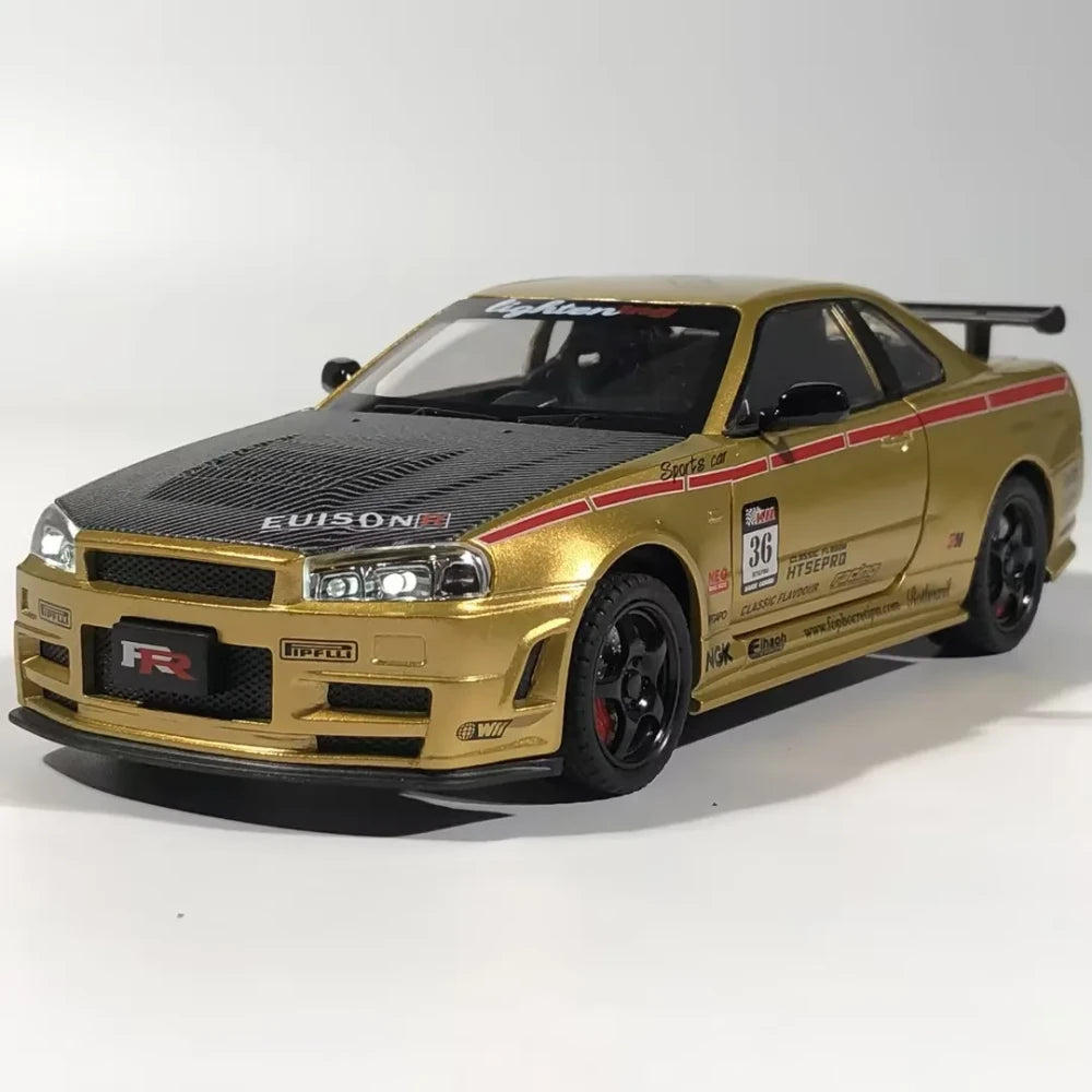 Gold Nissan Skyline GT-R diecast model with carbon hood, racing decals, and black rims