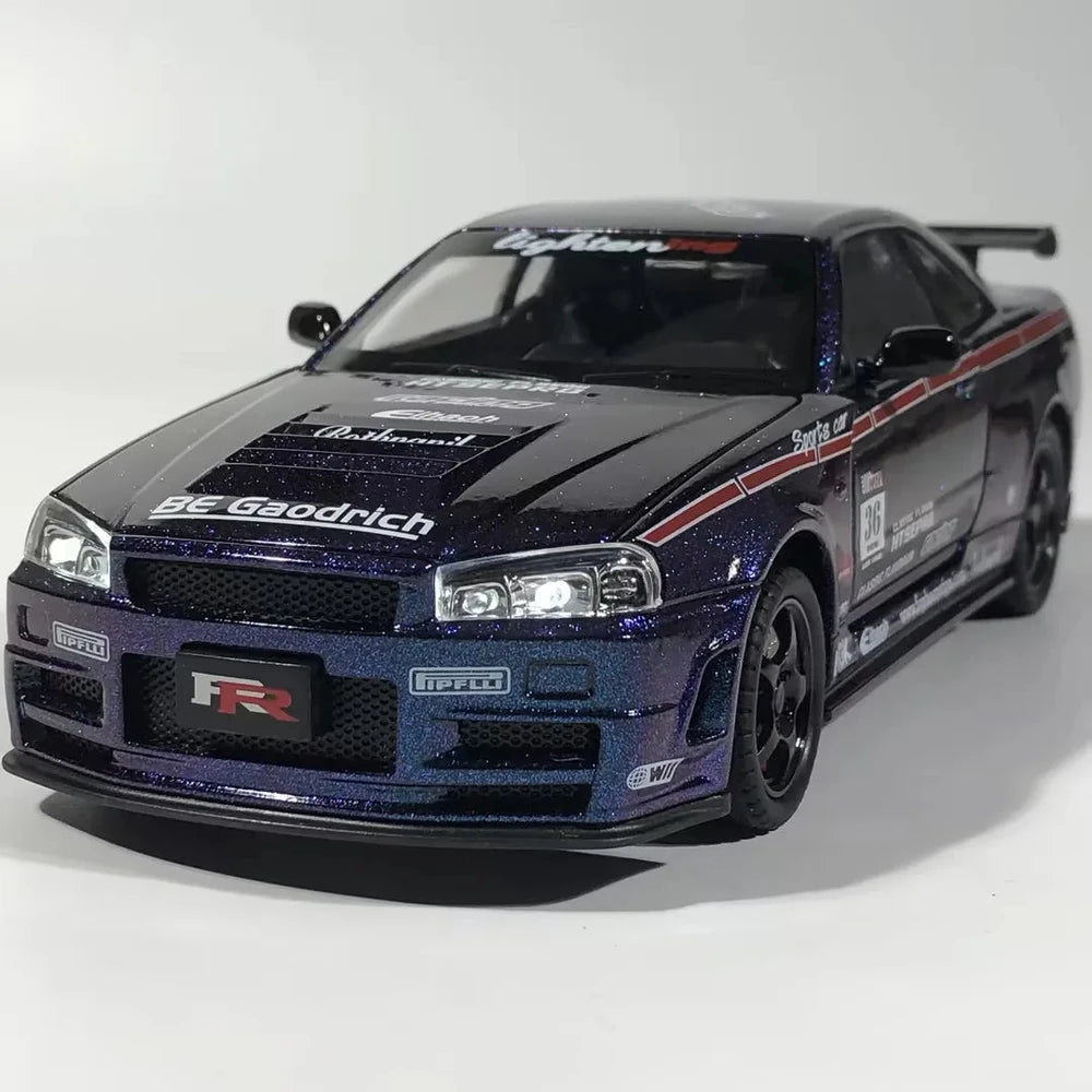 Shiny blue Nissan Skyline GT-R diecast model with racing decals and black rims