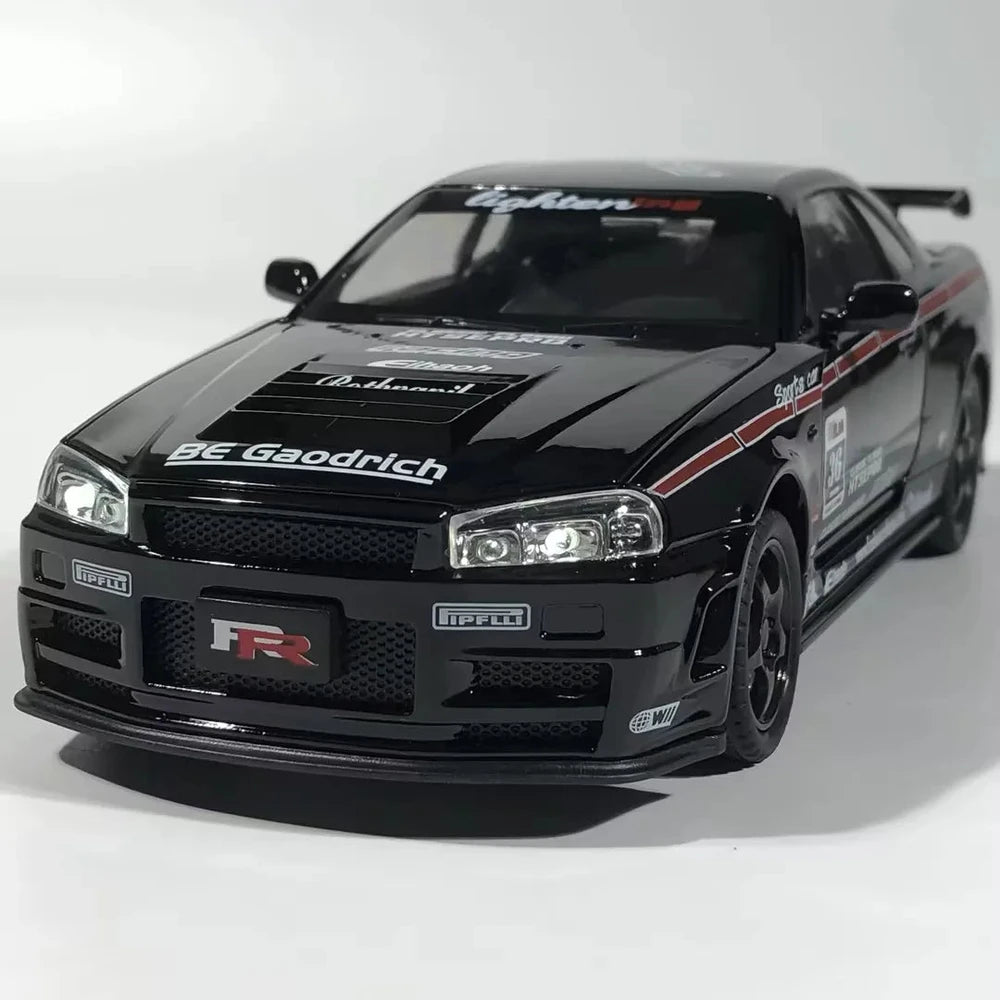 Black GT-R model car with racing decals, Pirelli branding, and detailed body kit on white background