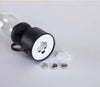Compact black LED night light with USB port, battery-powered, includes 3 coin batteries and wall mount