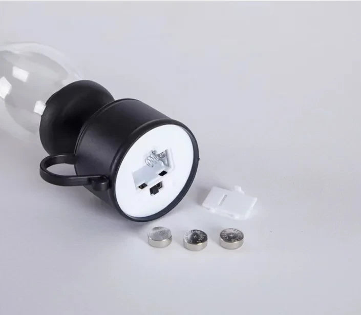 Compact black LED night light with USB port, battery-powered, includes 3 coin batteries and wall mount