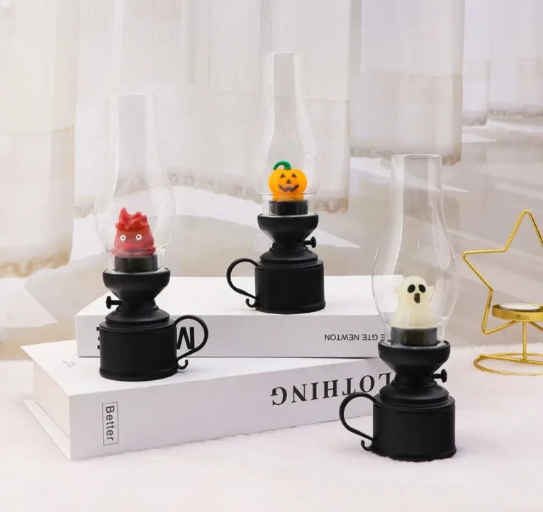 Halloween-themed oil lamp decor with ghost, pumpkin, and monster figures, perfect for cozy seasonal home styling