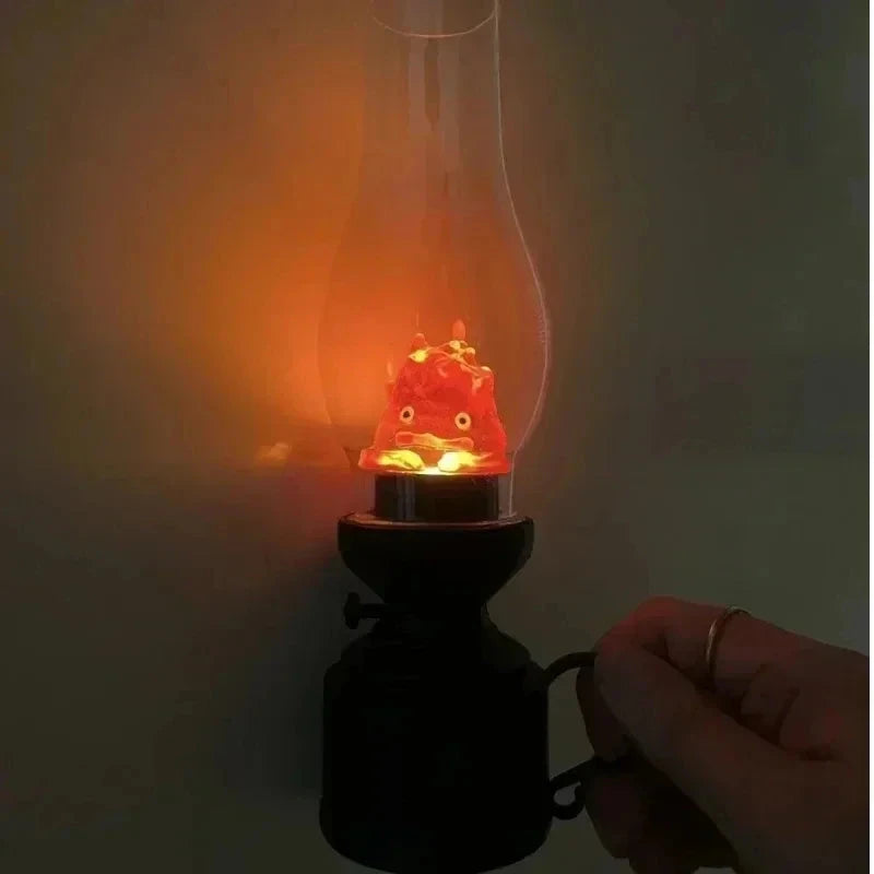 Glowing red lantern with cute character inside, held in hand for cozy ambiance
