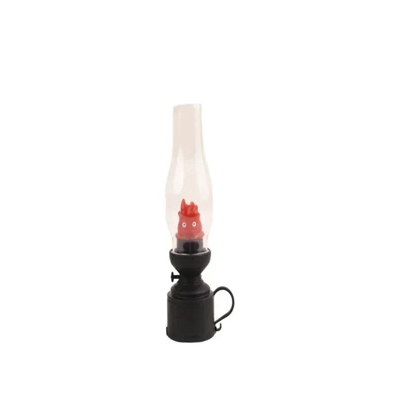 Black oil lamp with clear glass chimney and red flame bulb, cozy home decor accent