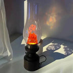 Cute flame lamp with glowing orange character inside glass shade, cozy ambient lighting