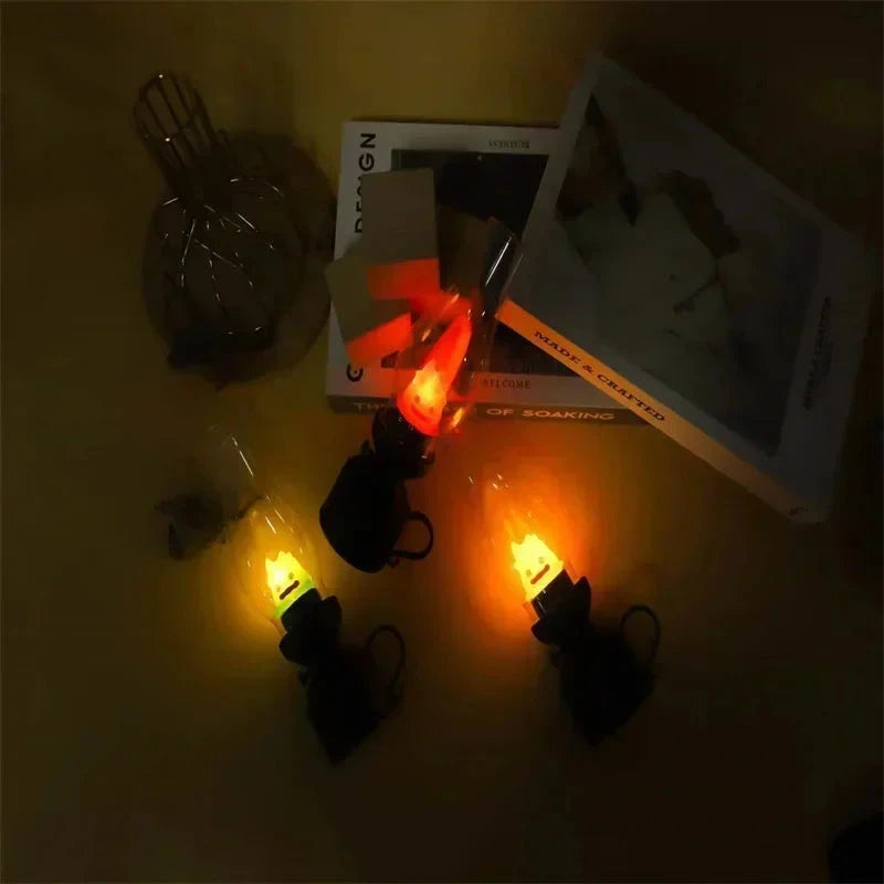 Cozy warm glow from decorative LED flame bulbs on dark surface with books, perfect for ambient home lighting