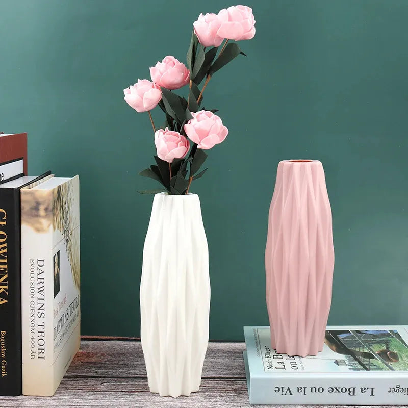 White and pink textured vases with pink peonies, styled on wooden shelf with books for modern home decor