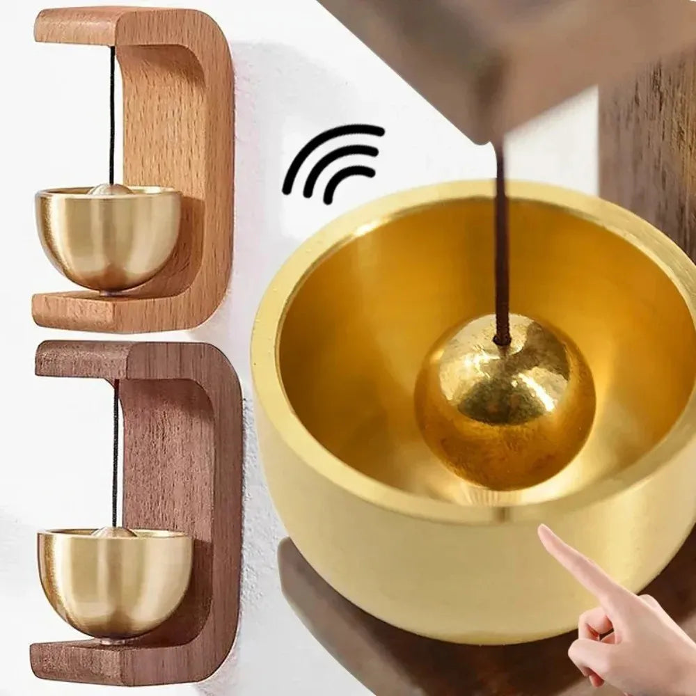 Golden singing bowl with wooden holder, hand striking for meditation sound therapy