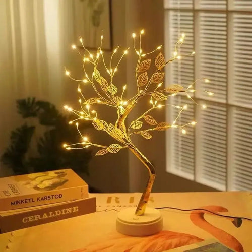 Golden LED tree lamp with warm fairy lights, perfect for cozy bedroom or desk decor