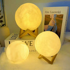 Glowing 3D moon lamps with wooden stands, cozy bedroom nightlight decor