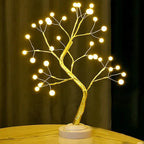 Golden LED tree lamp with warm glow, perfect for cozy home decor and ambient lighting