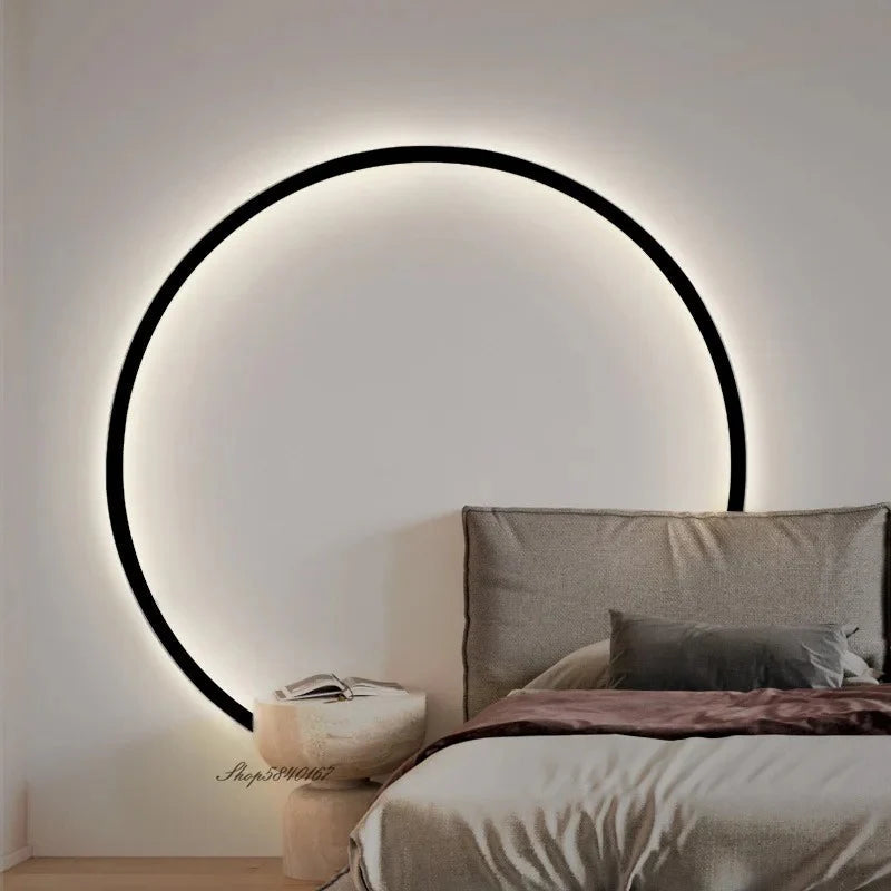 Modern circular wall light above bed, minimalist bedroom decor with ambient glow
