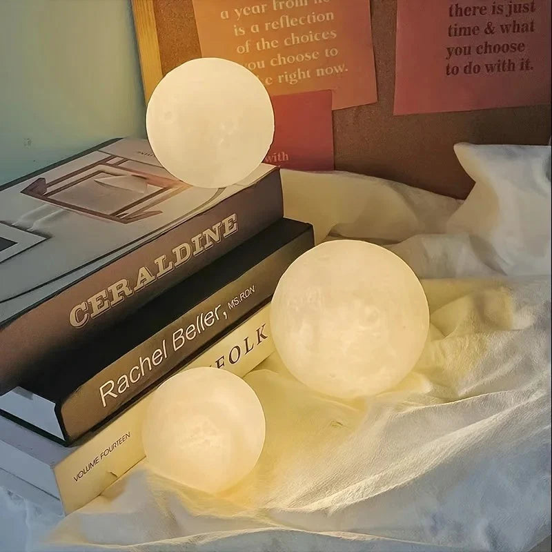 Glowing moon lamps on books beside cozy bedding, ambient nightlight decor