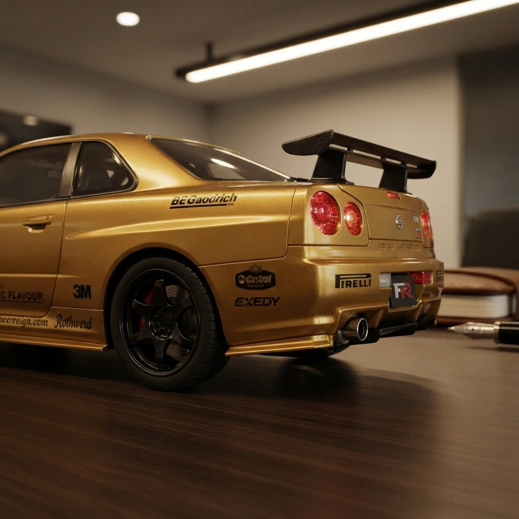 Gold Nissan GT-R model car with racing decals, rear spoiler, and Pirelli branding on desk